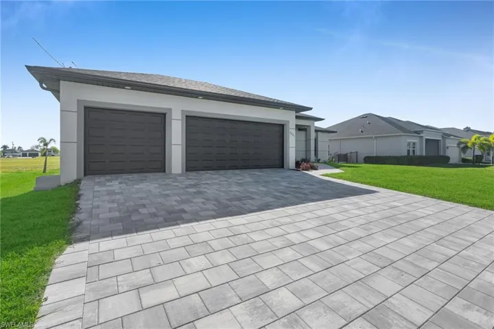 Garage with decorative driveway