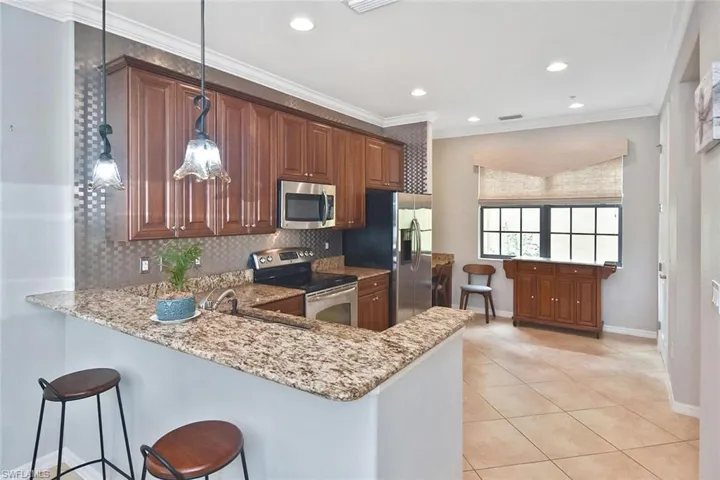 A breakfast bar is a great place to keep the cook company!