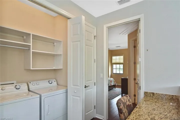 The laundry area is conveniently located between the bedrooms.