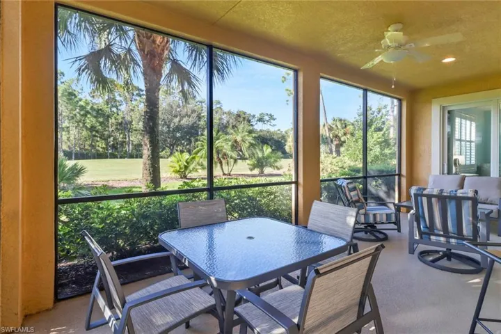 Screened Porch featuring ceiling fan