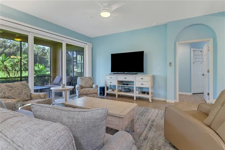 Living room featuring ceiling fan