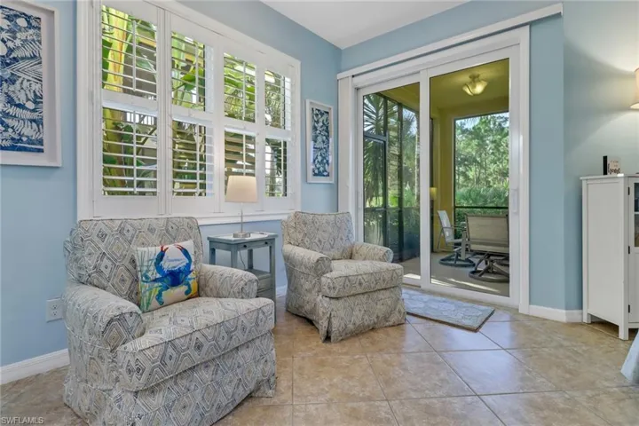 Sitting room featuring a healthy amount of sunlight and light tile patterned flooring