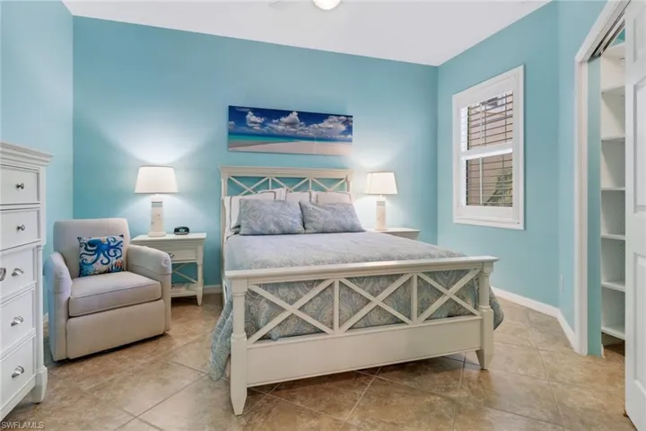 Bedroom featuring ceiling fan and light tile patterned floors