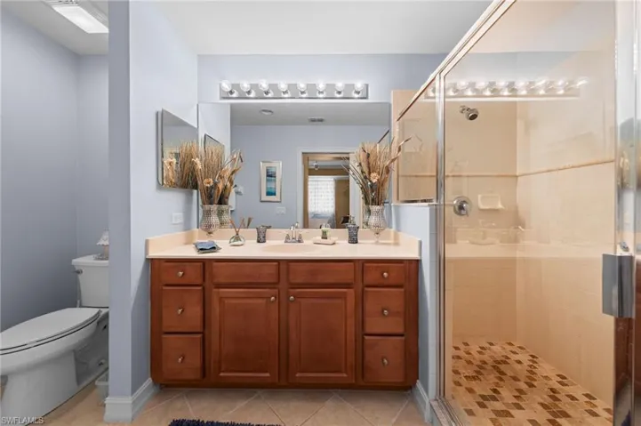Spa like bathroom with walk-in shower and big vanity.