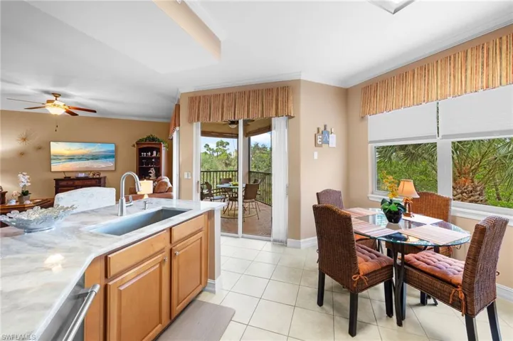 Eat-in space to enjoy overlooking nature and leading to the screened in lanai.