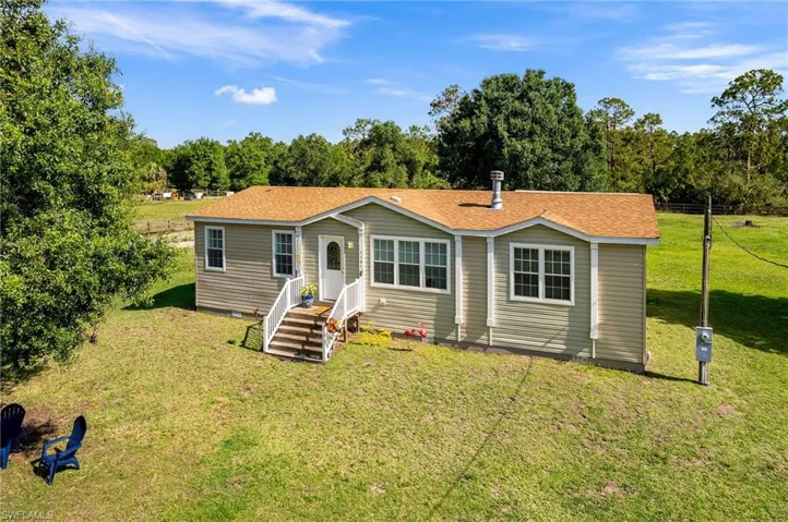 View of front of house featuring a front lawn