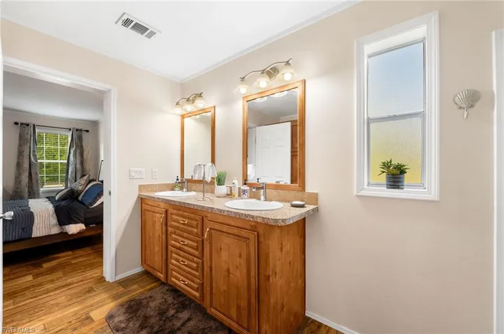 Bathroom with vanity and hardwood / wood-style flooring