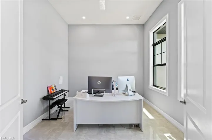 Tiled home office with a healthy amount of sunlight