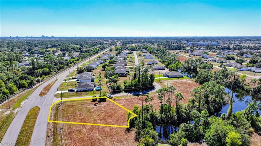 Aerial perspective of suburban area featuring property boundaries highlighted