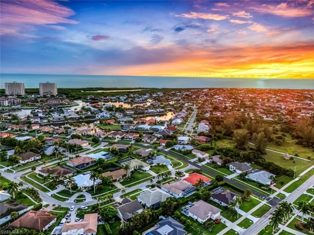 Aerial view at dusk of a water view and a residential view