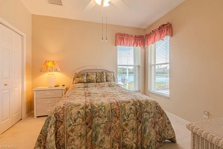 Bedroom #2 featuring carpet, a closet, and ceiling fan