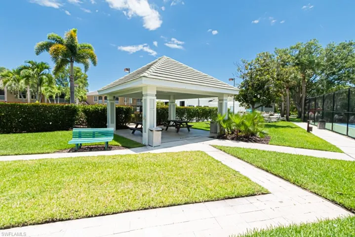 View of property's community with a yard and a gazebo