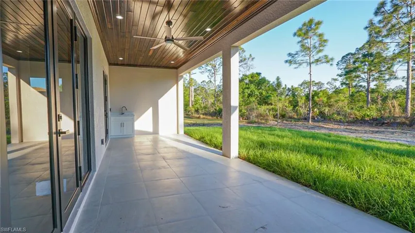 View of patio featuring ceiling fan and a sink