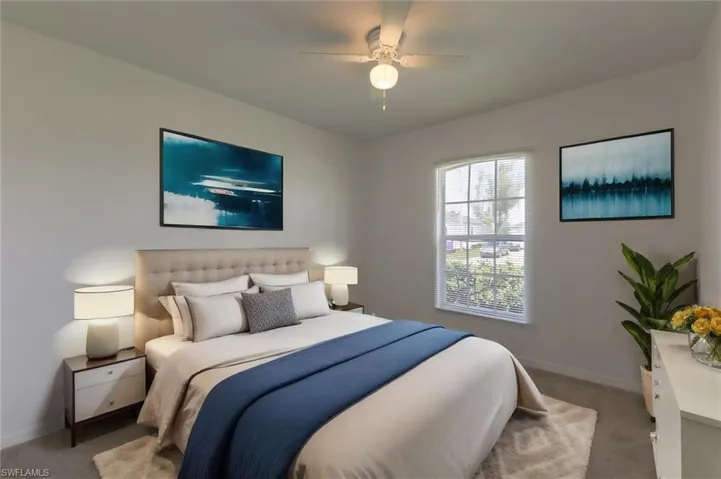 Bedroom featuring carpet flooring and ceiling fan