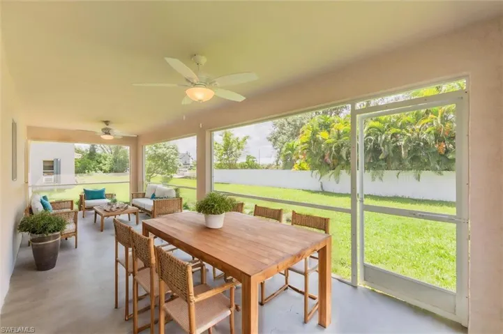 Sunroom with ceiling fan and plenty of natural light