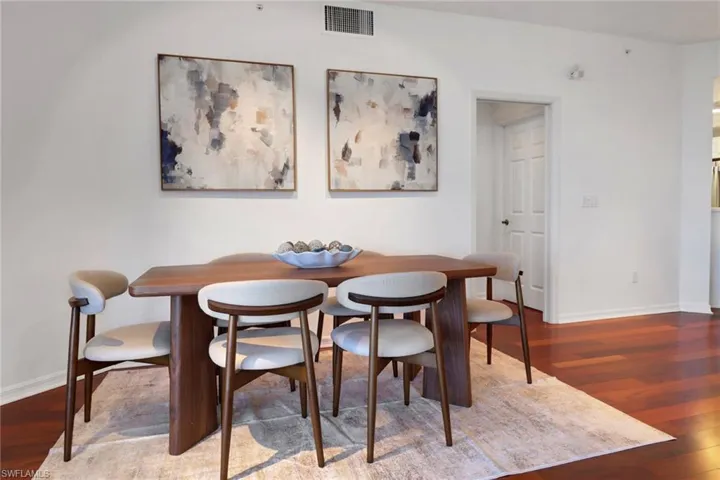 Dining room featuring wood finished floors and baseboards