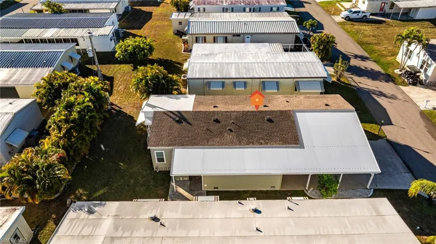 View of new roof shingle and metal