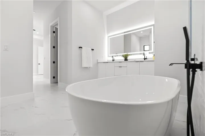 Empty room with baseboards and light marble finish floors