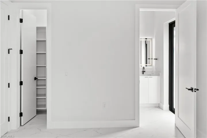Detailed view of wine cooler and baseboards