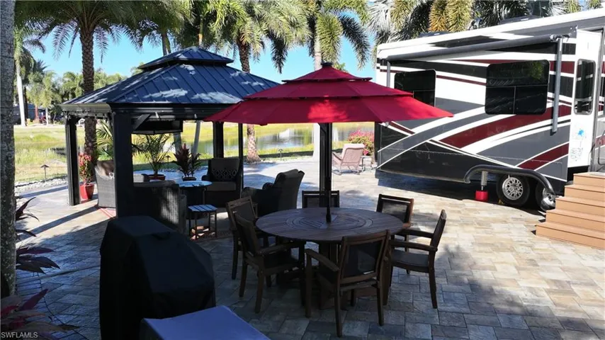View of patio / terrace featuring a gazebo, outdoor dining space, and area for grilling