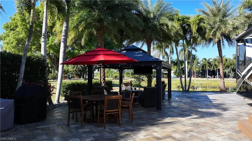 View of patio / terrace with a gazebo, area for grilling, and outdoor dining area
