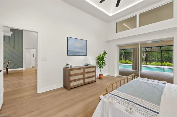 Primary Bed has a direct site line of the Pool Area & 26-Acre Preserve along with the Wood Focal Wall