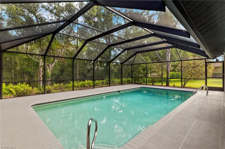 Newly Renovated Pool Cage painted Bronze overlooking the 26 Acre Nature Preserve