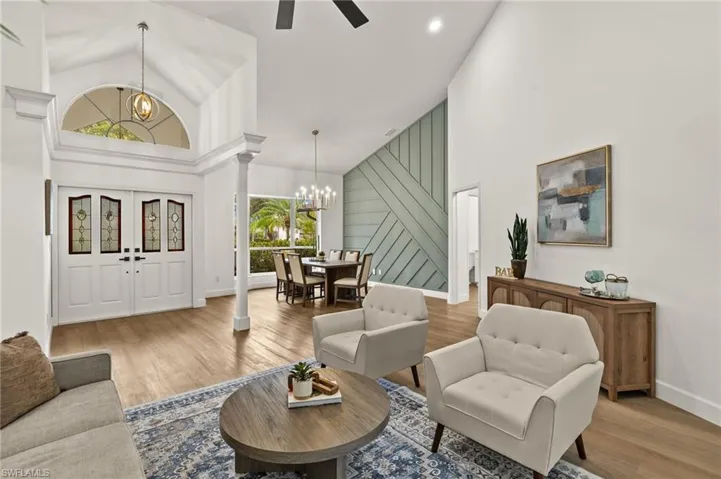 Formal Living Room has a direct site line to the stunning Wood Focal Wall & Front Foyer