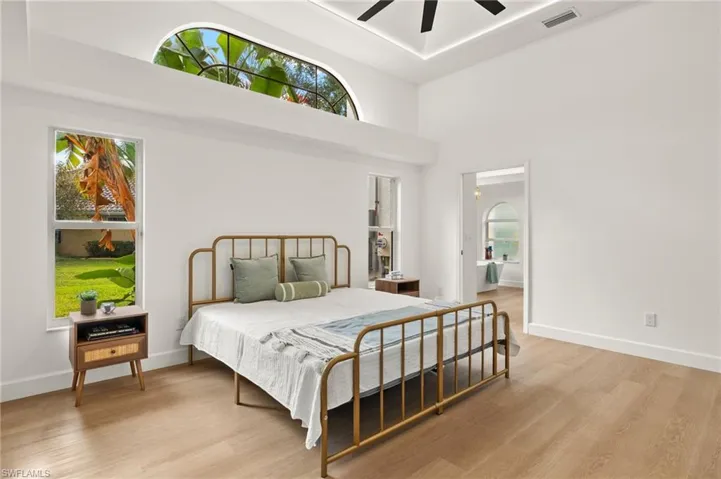Primary Bedroom Tray Ceiling is almost 16FT High and the accent lighting elevates the space.