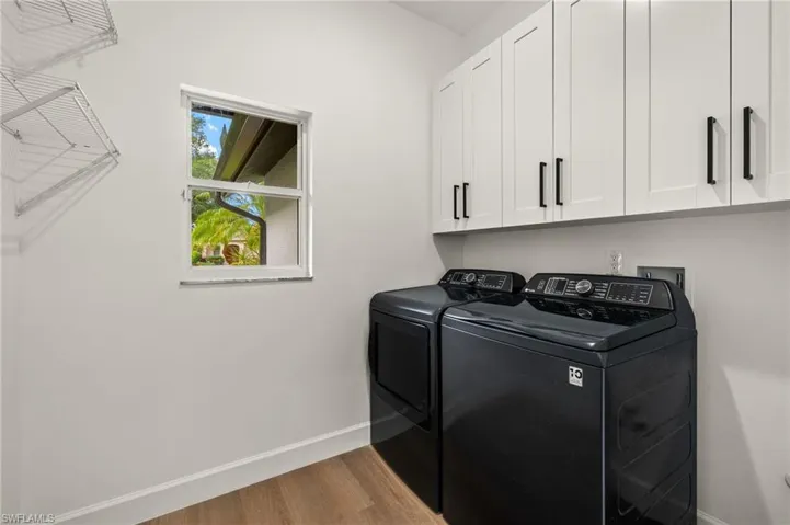 New Laundry Room with 42" Upper Shaker Cabinets, New GE Profile Washer and Dryer & Custom Built in Iron Board