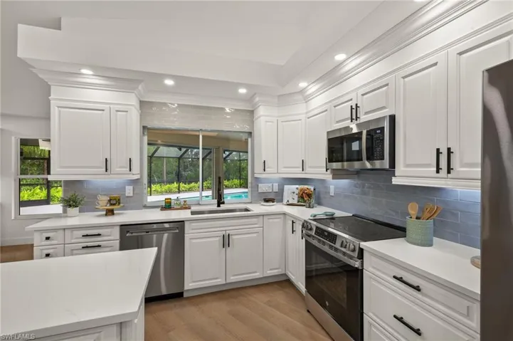 There is a Sliding Window that leads out to a Custom Outdoor Quartz Counter overlooking the Pool