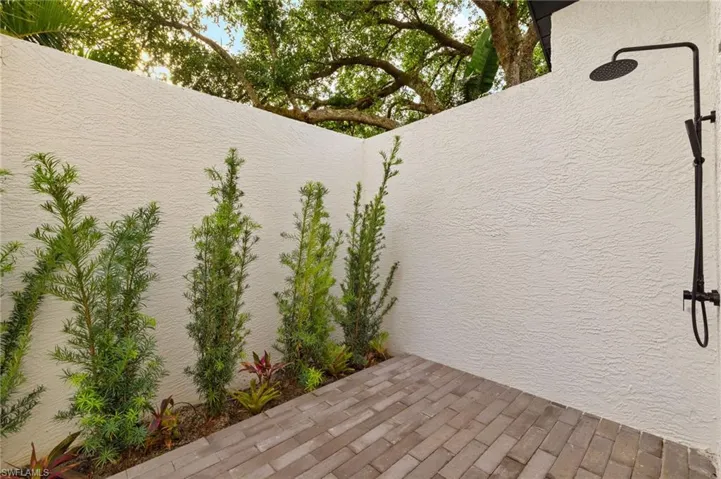Primary bath has a Private Patio with New Brick Pavers & a Outdoor Shower with Hot & Cold Water