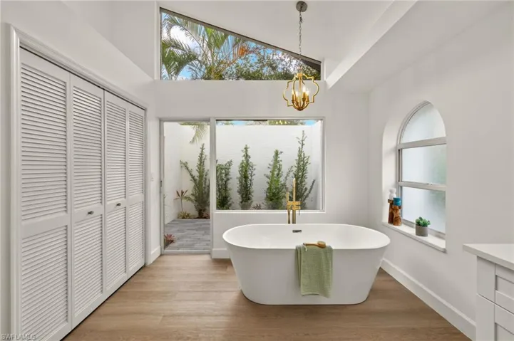 The 67" Free Standing Tub overlooks the Private PrimarY Bath Patio with its New Landscaping