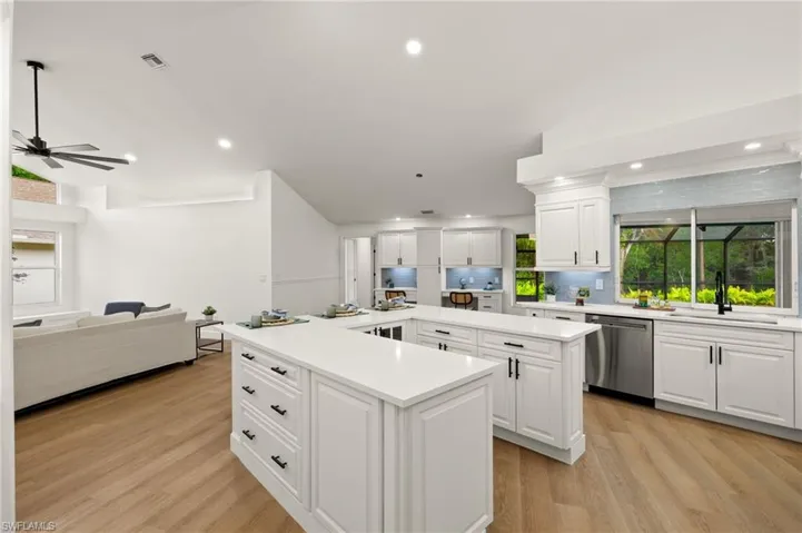 Off the Kitchen is the expanded Area with 2 Work Stations, a Free Standing Pantries, Cabinets, etc.