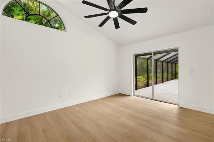 Guest Bedroom with Custom Half Moon Glass & Sliders out to the Newly Renovated Pool Area