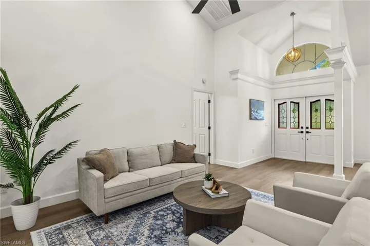 Formal Living Room with New Paint, New 5 1/4' Baseboards, a Stunning Front Foyer with New Chandelier