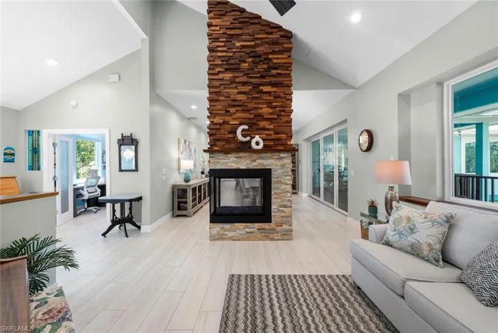 Family room and fireplace with office on left