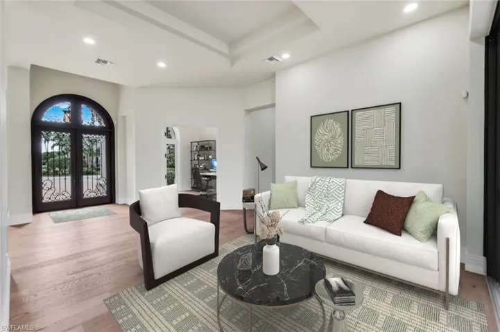 VIRTUALLY STAGED & FURNISHED Living Room facing Front door.