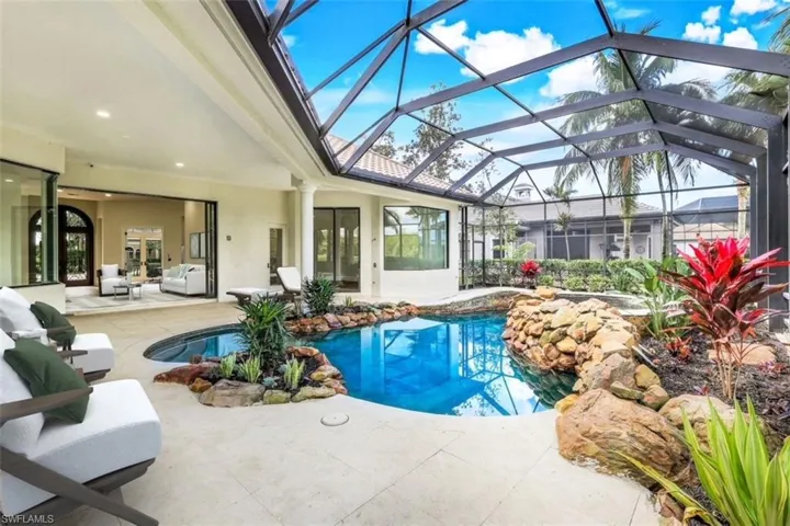 VIRTUALLY STAGED & FURNISHED Screened pool area with new pool deck.