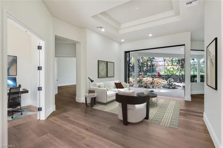 VIRTUALLY STAGED & FURNISHED adjacent to Kitchen and overlooking pool.