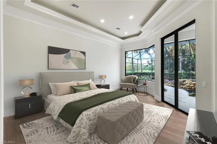 Master Bedroom suite VIRTUALLY STAGED & FURNISHED, tray ceiling, hardwood floors, crown molding and pool access!