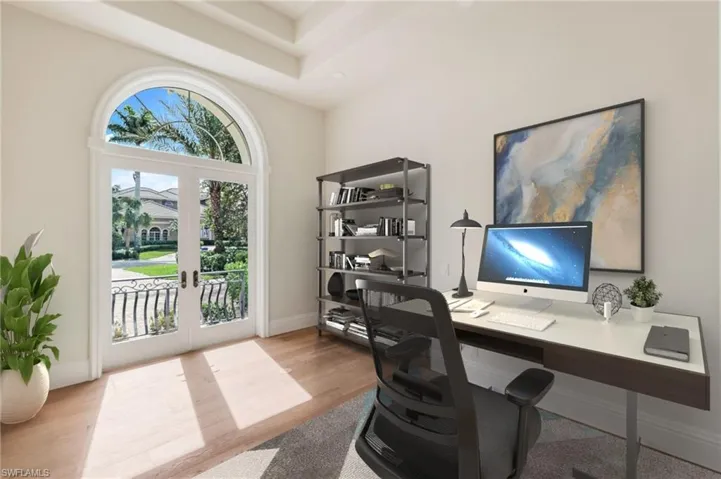 VIRTUALLY STAGED Office featuring french doors and hardwood flooring