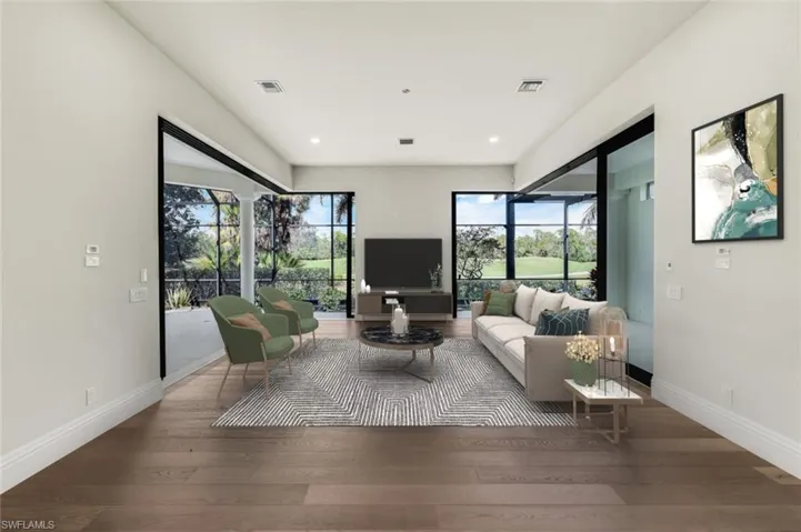 VIRTUALLY STAGED & FURNISHED Family room adjacent to kitchen overlooking pool and golf course.