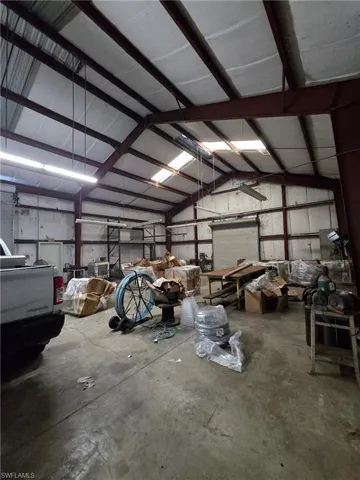 Garage featuring metal wall