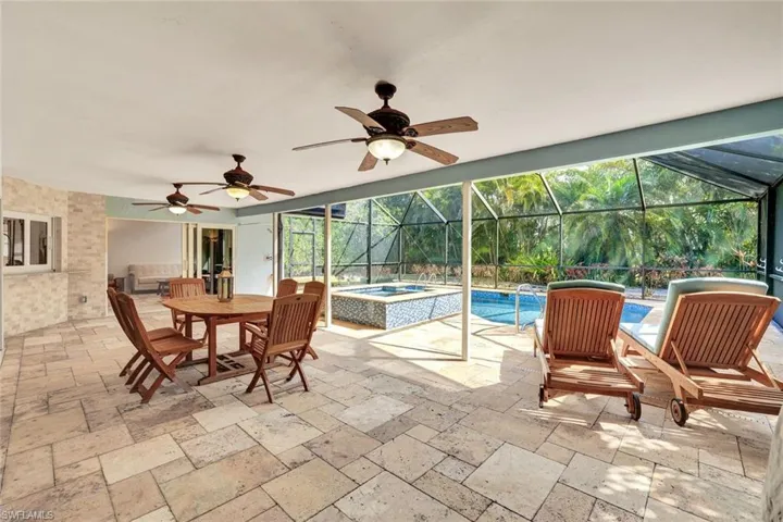 Expansive back lanai with privacy screen, perfecting for entertaining guests