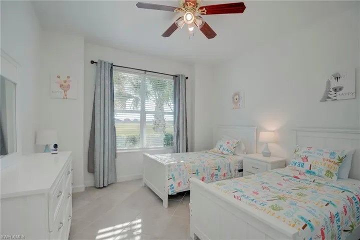 Bedroom featuring ceiling fan and light tile patterned floors