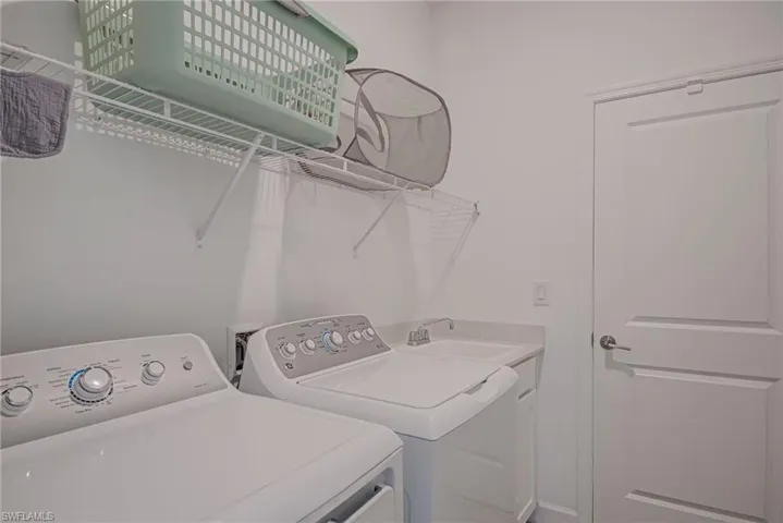 Washroom featuring separate washer and dryer