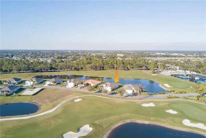 Aerial overview of property's location with a local golf course and nearby suburban area