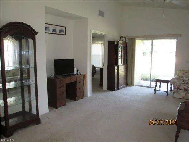 Sliders open onto lanai from living area.