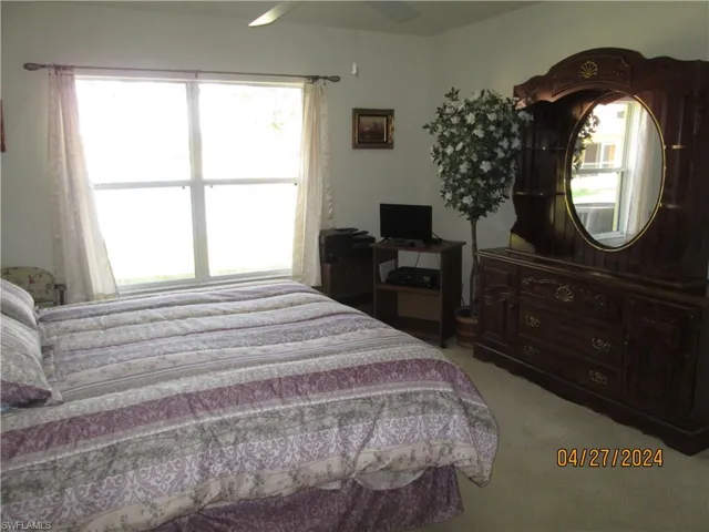 Owner's suite at rear of home with water view.